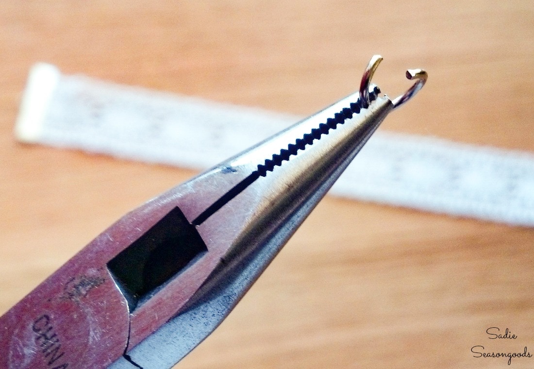 Attaching the broken jewelry to the ribbon bookmarks