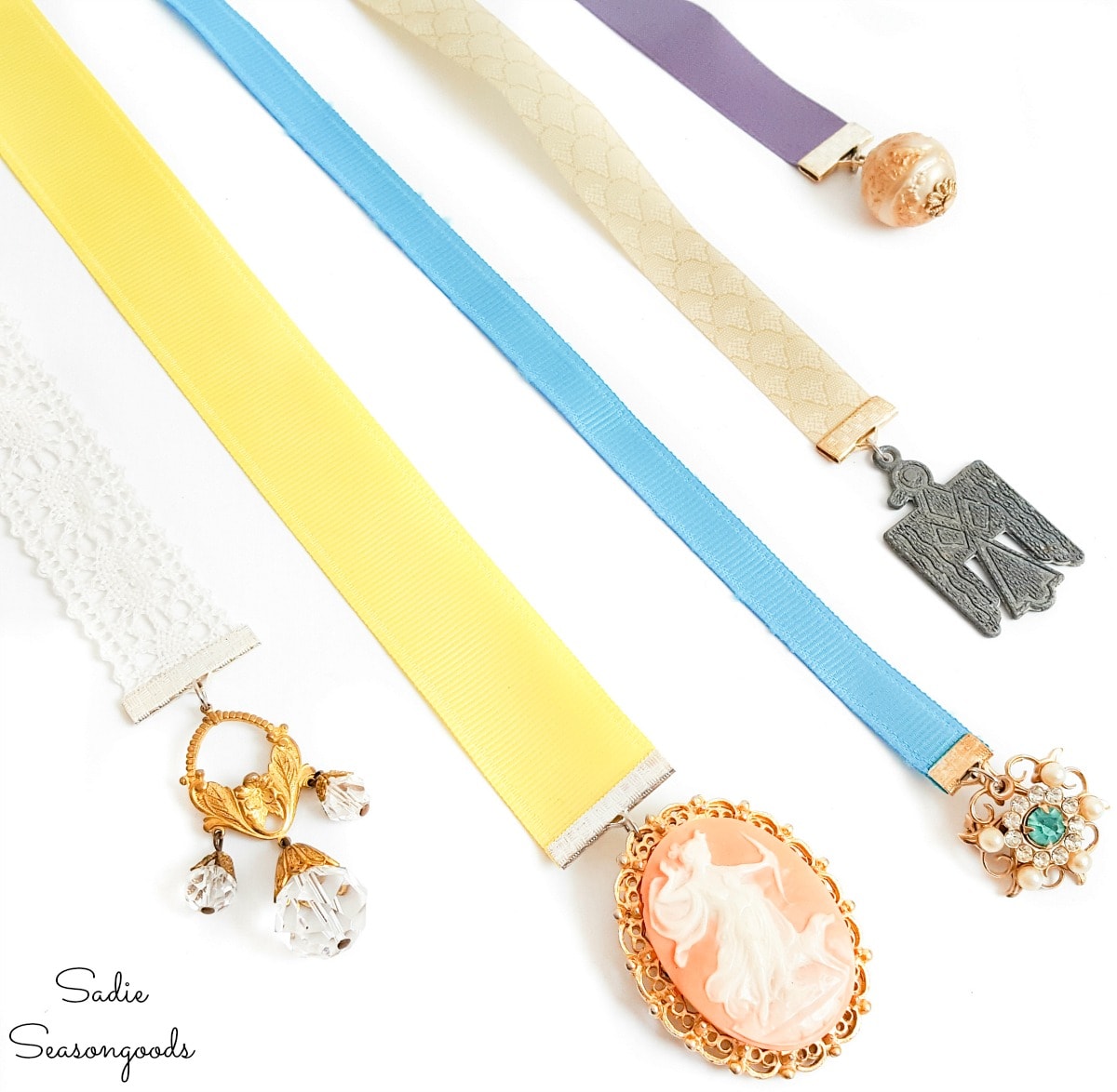 Old jewelry as charms on ribbon bookmarks