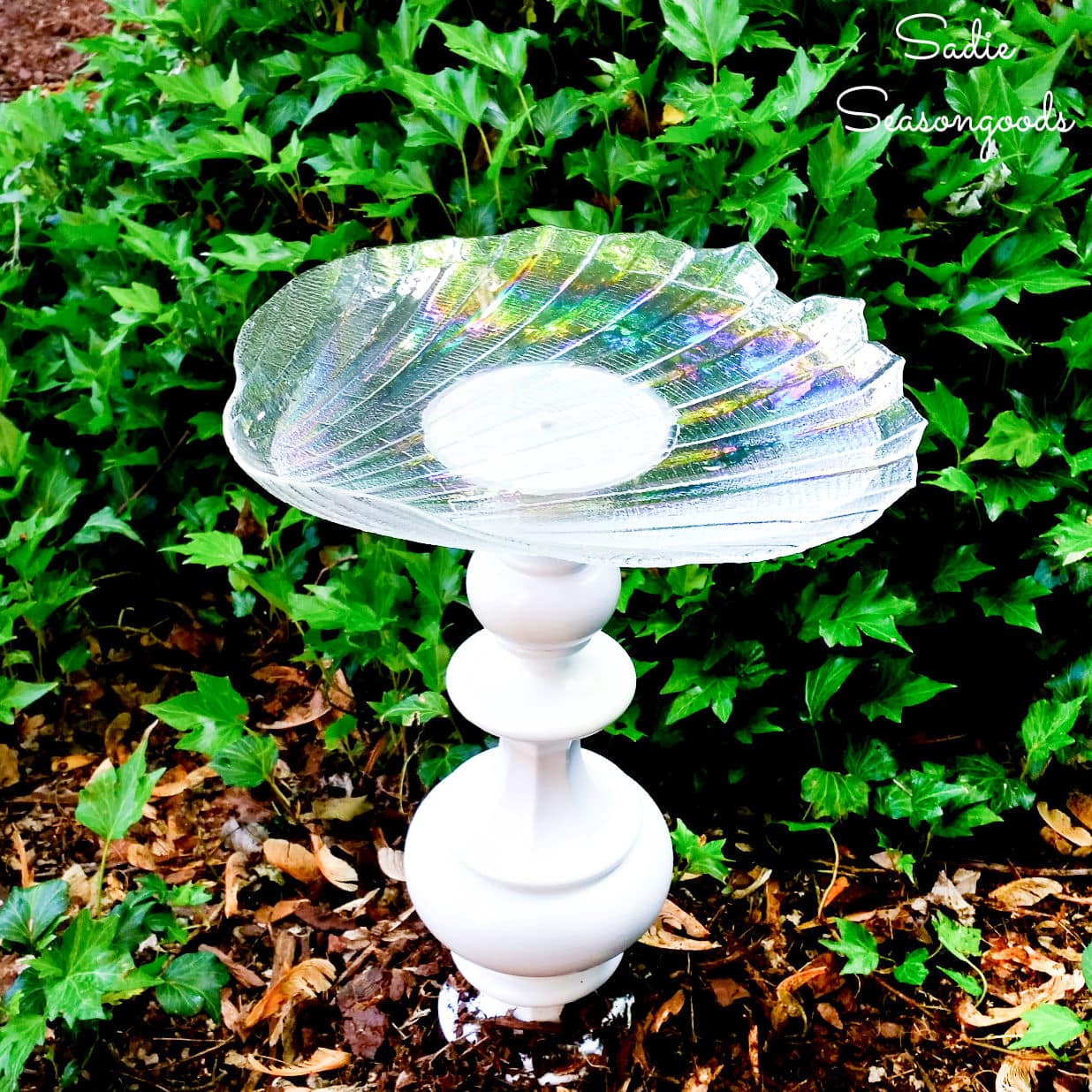 diy birdbath that was made from a vintage lamp and a glass dish