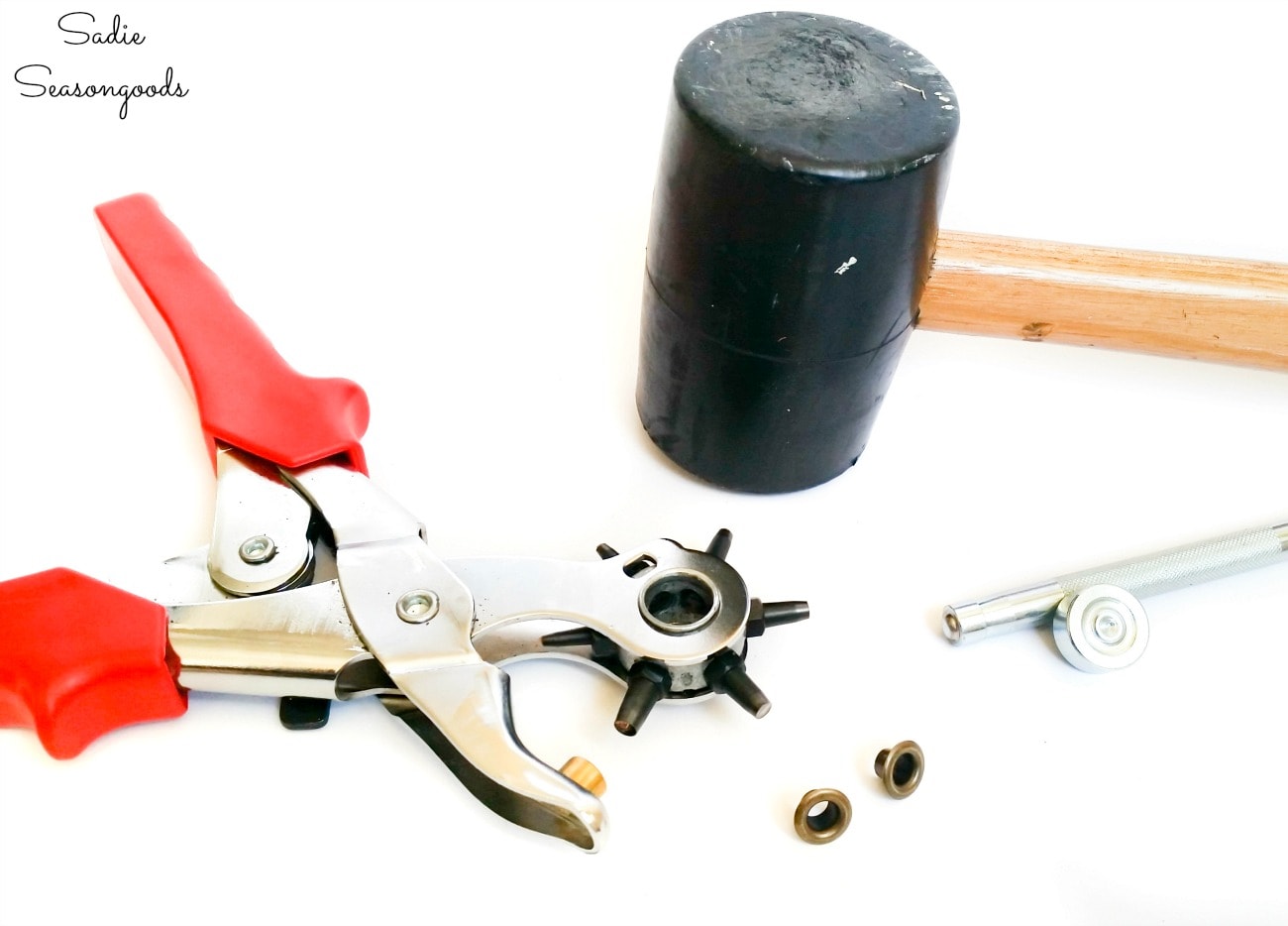 Leather stamping tools and a hole punch for eyelets in a leather belt