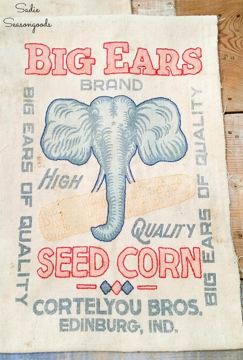 Beginner embroidery on vintage feed sack fabric