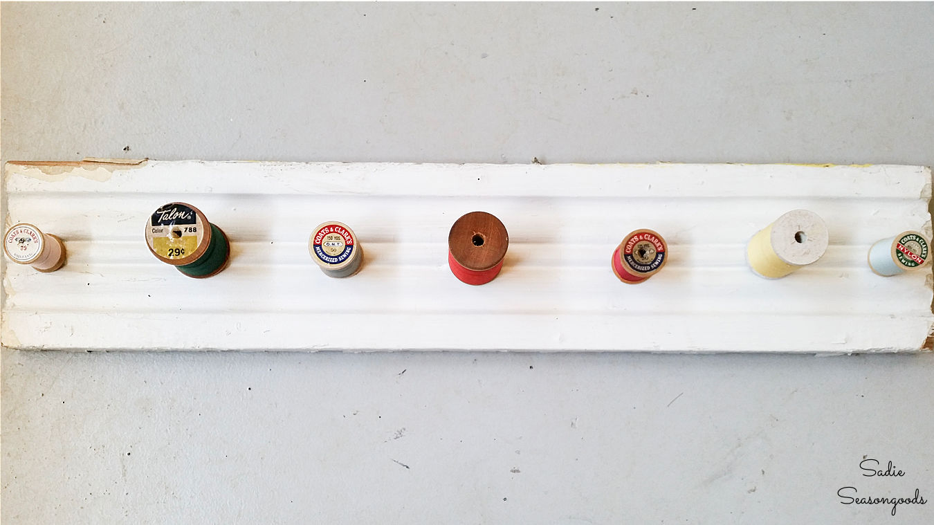 making a wooden necklace holder with thread spools