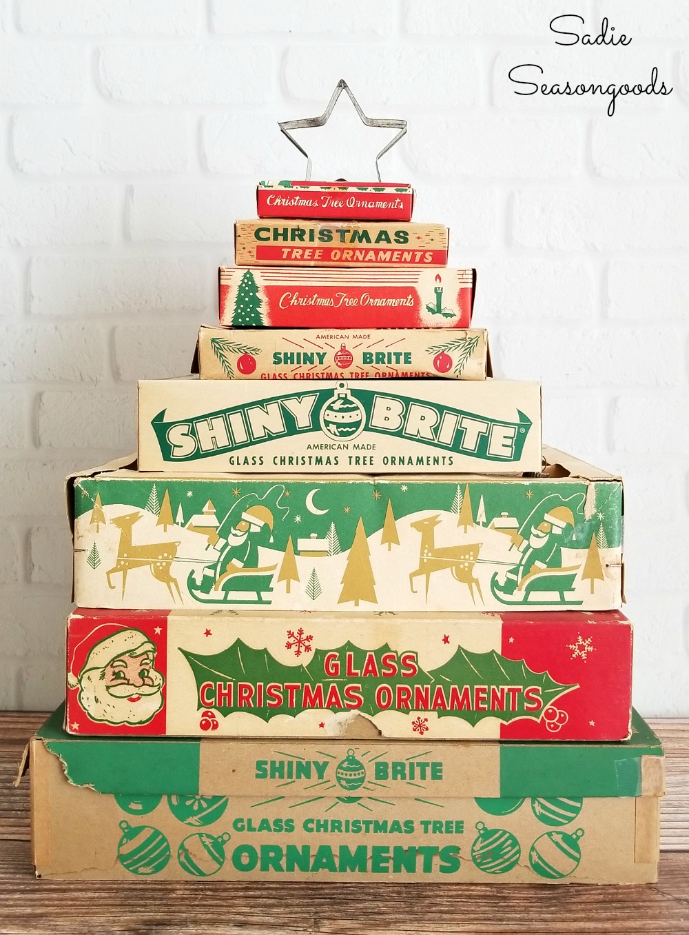 Stacked ornament boxes or vintage ornament boxes stacked together like a Christmas tree to display their vintage graphics for Christmas decor by Sadie Seasongoods / www.sadieseasongoods.com Stacked ornament boxes or vintage ornament boxes stacked together like a Christmas tree to display their vintage graphics for Christmas decor by Sadie Seasongoods / www.sadieseasongoods.com