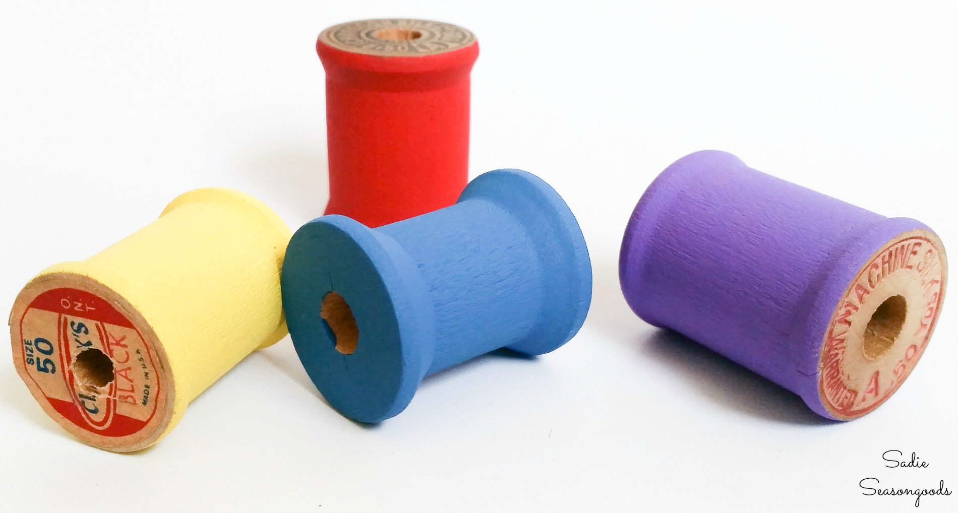 Painting the wooden thread spools