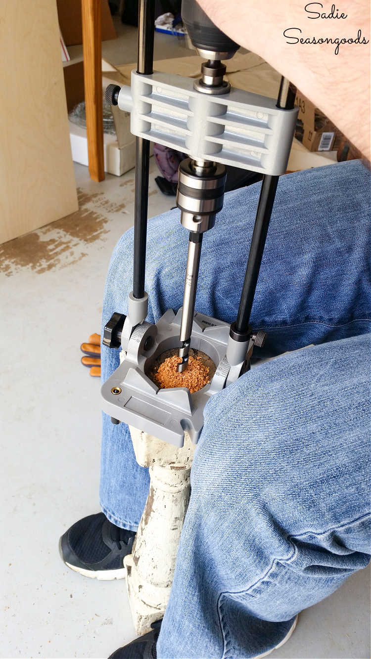 drilling a hole through a baluster to make a diy lamp