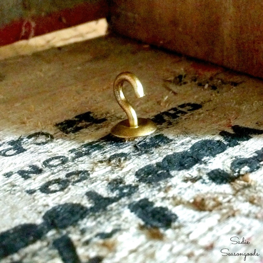 Cup hook in a wooden bottle crate