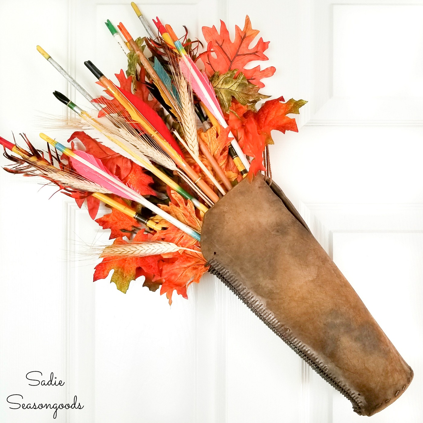 Autumn door decor with a leather arrow quiver