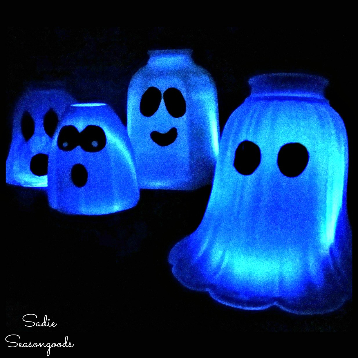 Ghost light for light up Halloween decorations by upcycling the glass light covers with white glowsticks by Sadie Seasongoods