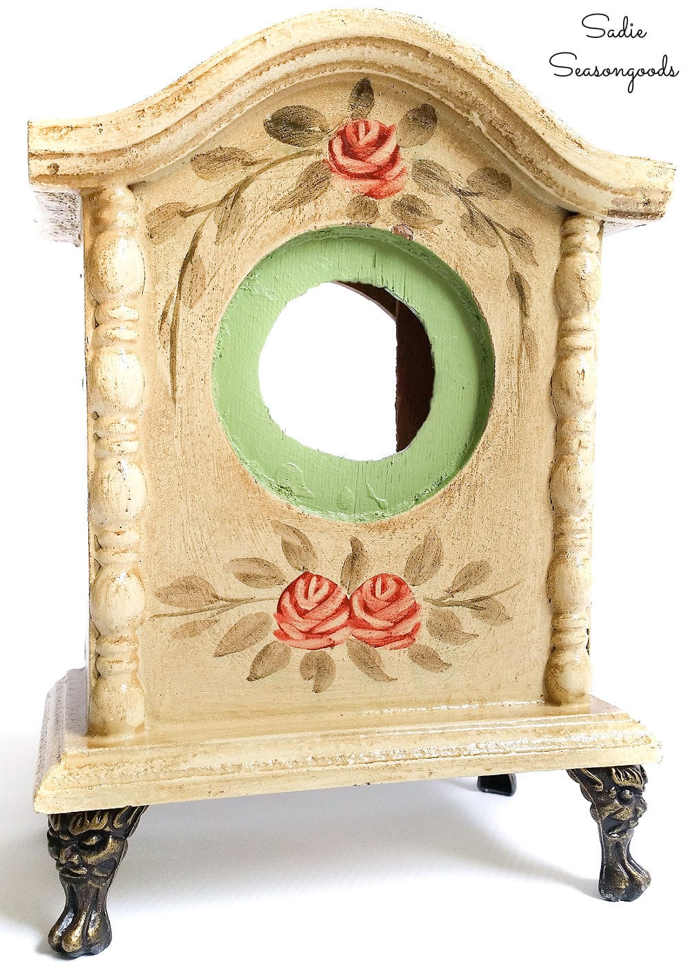 Repurposed birdhouse from a decorative table clock