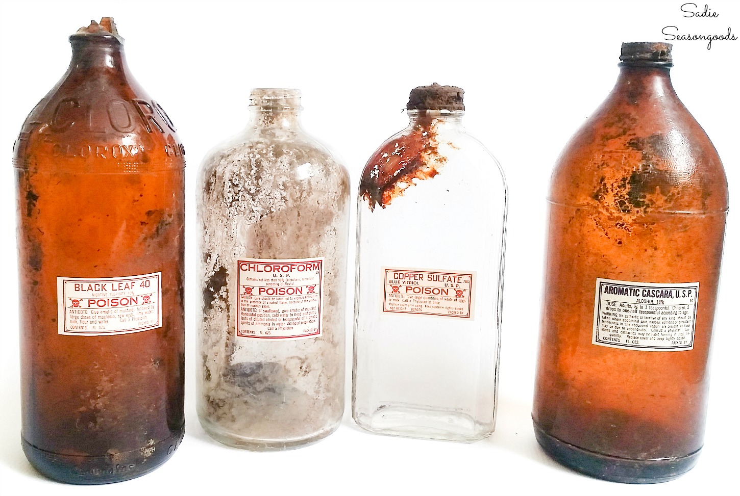 Antique poison bottles as apothecary decor for Halloween