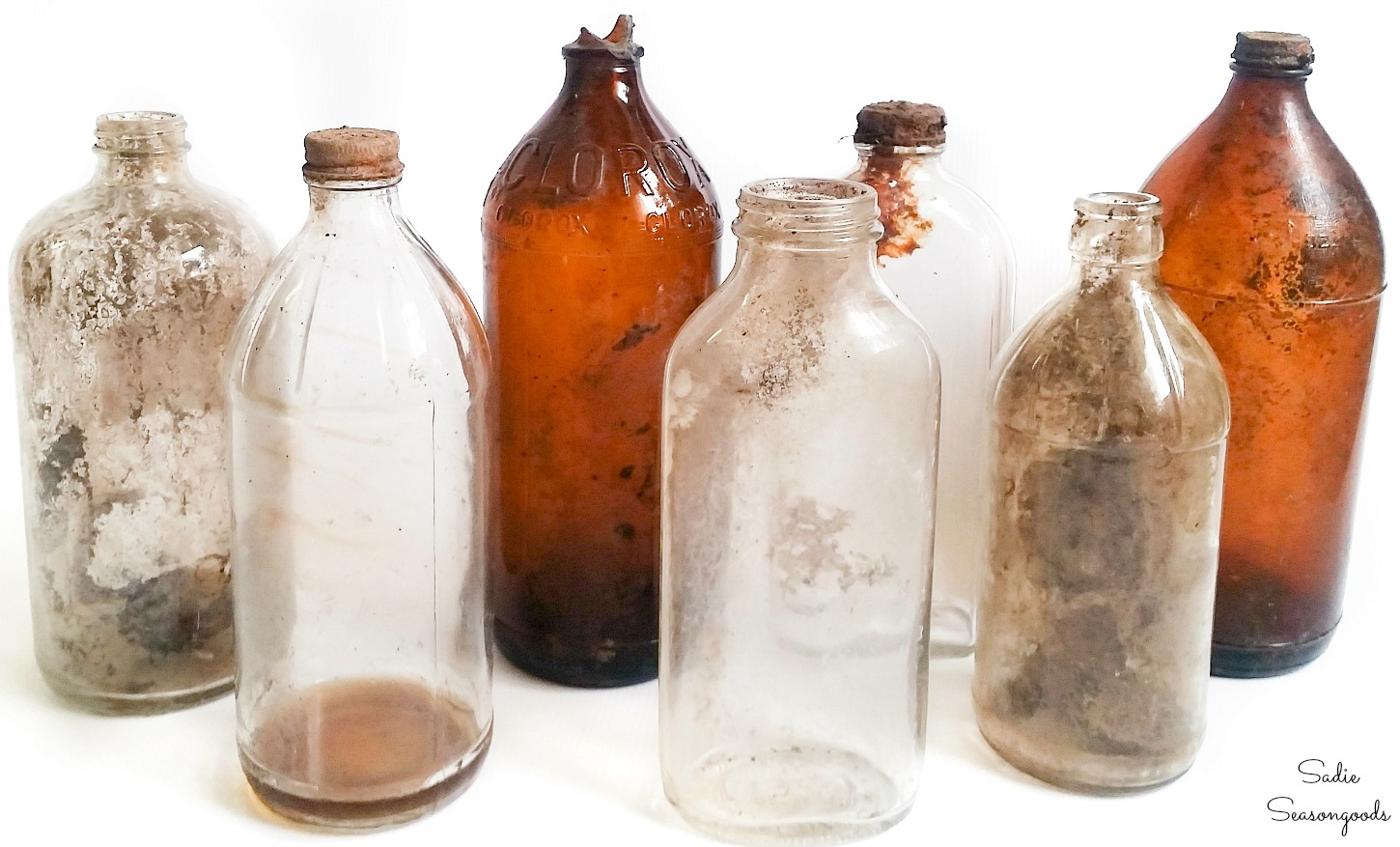 Old glass bottles from bottle digging to be used as Halloween poison bottles