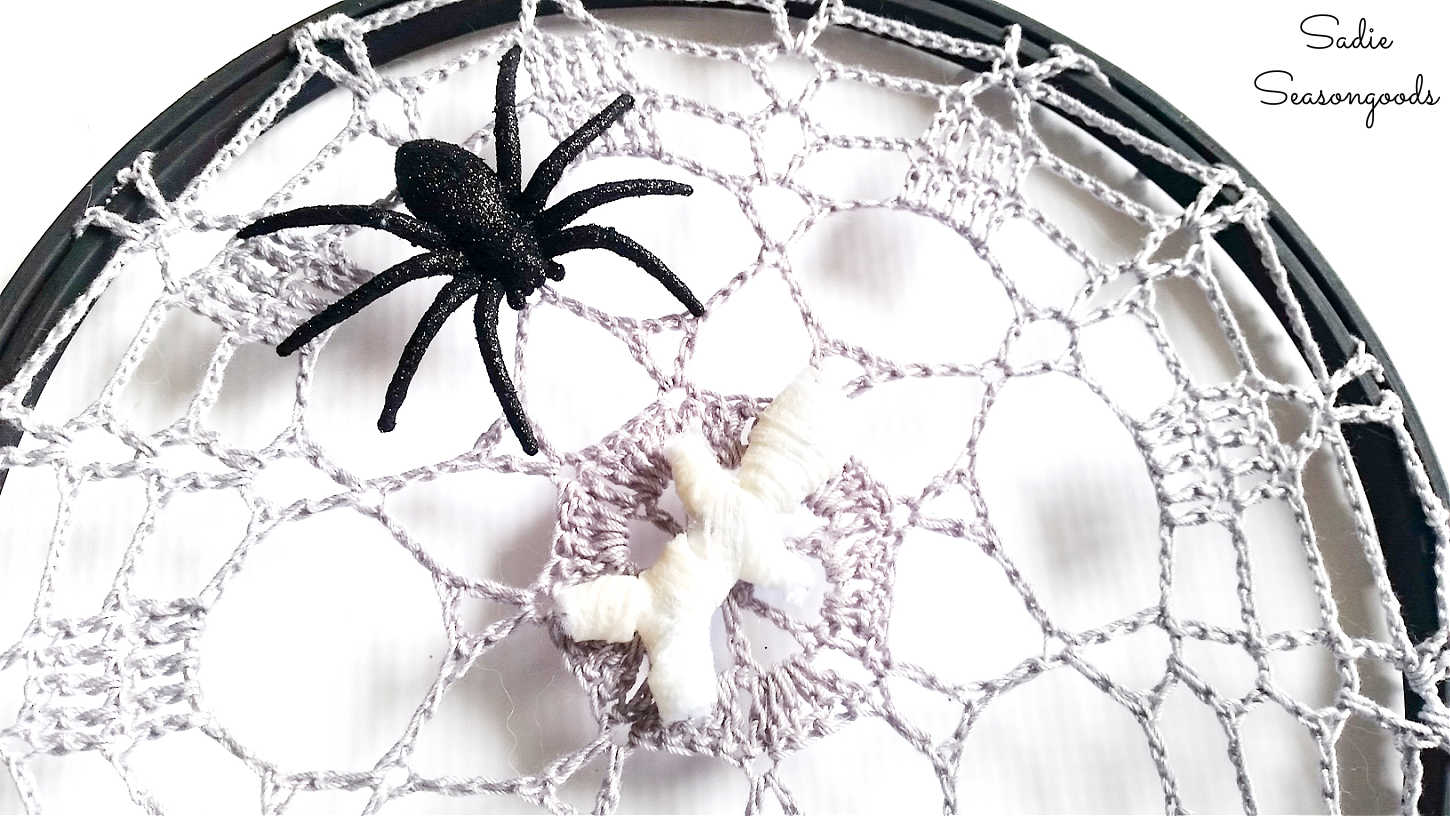 spider decor on a crochet spider web