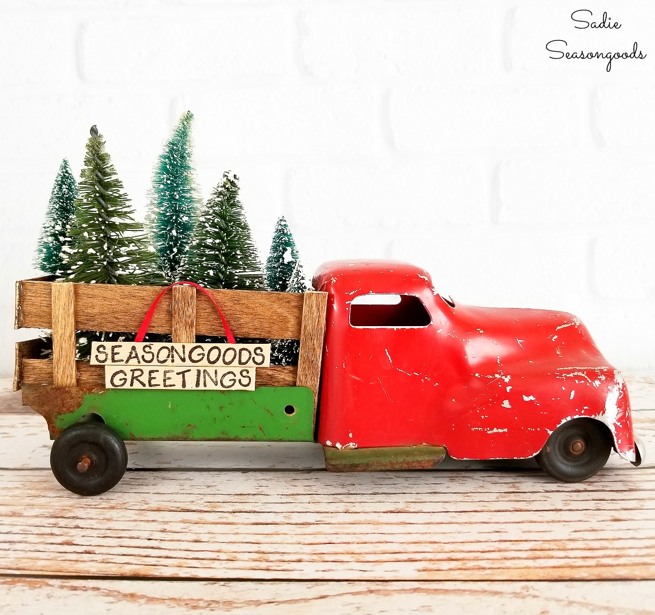 toy red truck with christmas tree