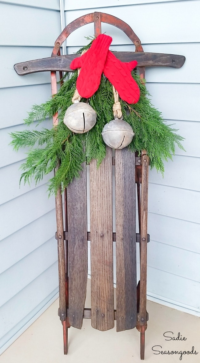 Sweater mittens on a wooden sled