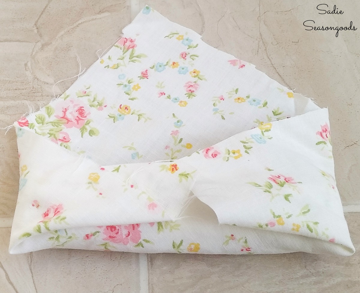 Covering the ring cushions with the fabric from a vintage sheet