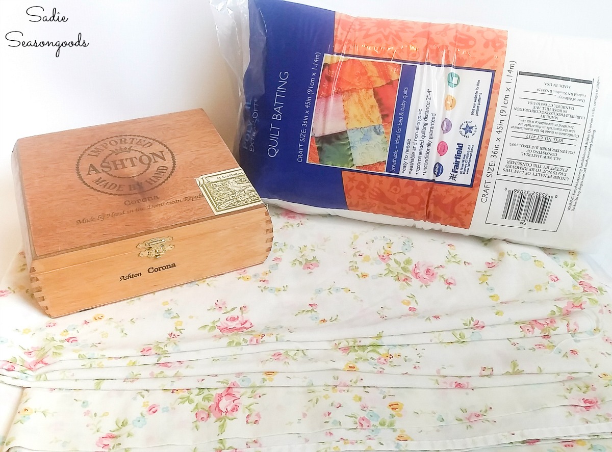 Quilt batting and floral sheet to make the ring cushions to go in a vintage cigar box