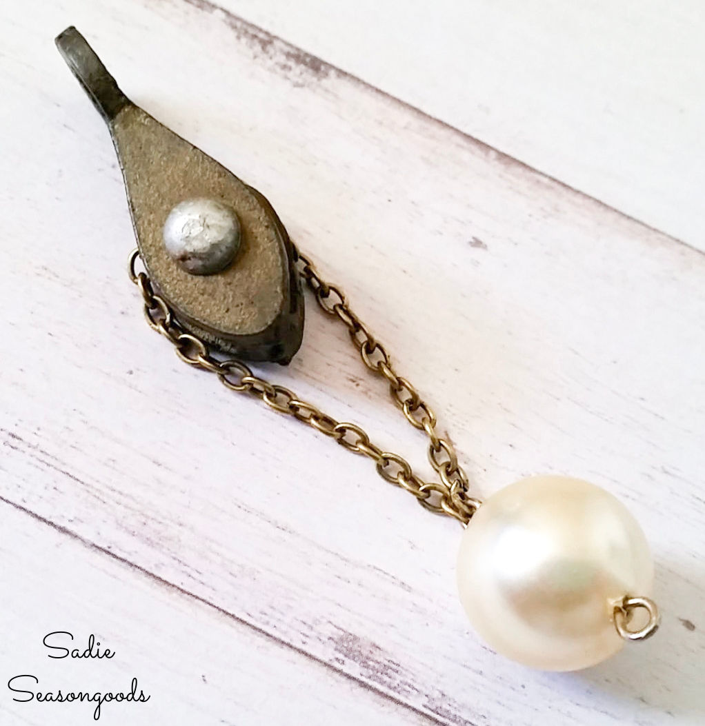 unique pendant necklace with a vintage pulley