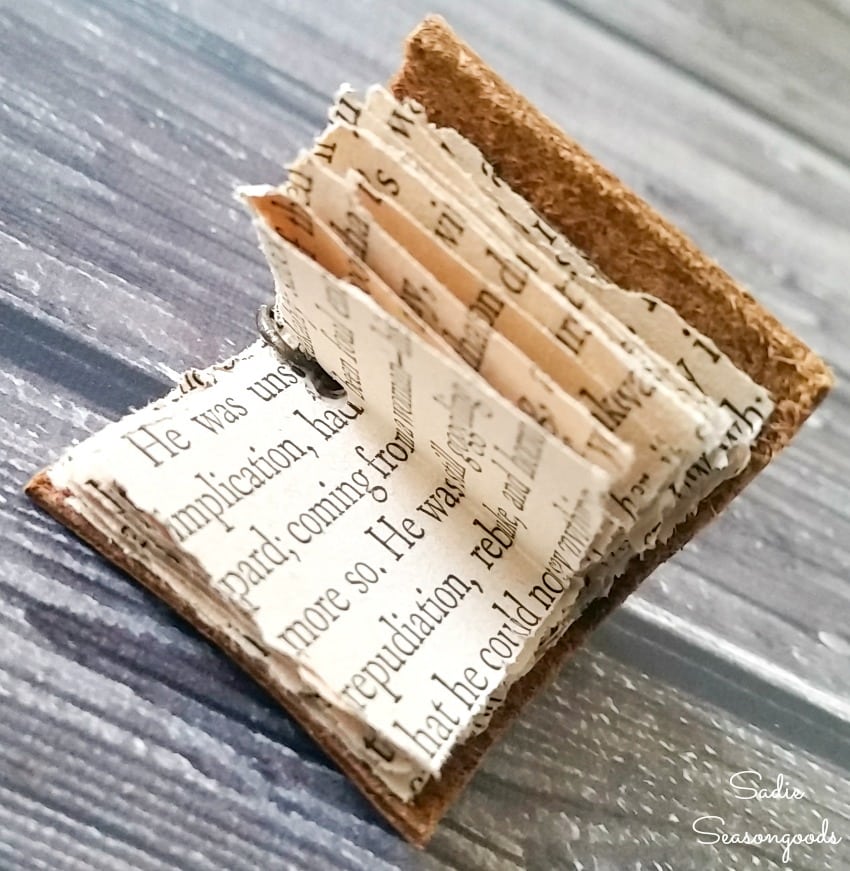 Upcycling books as book jewelry with leather scraps