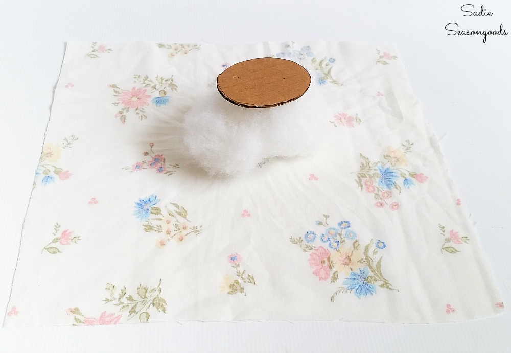 Needle cushion for a vintage teapot with fiber fill and a vintage bed sheet