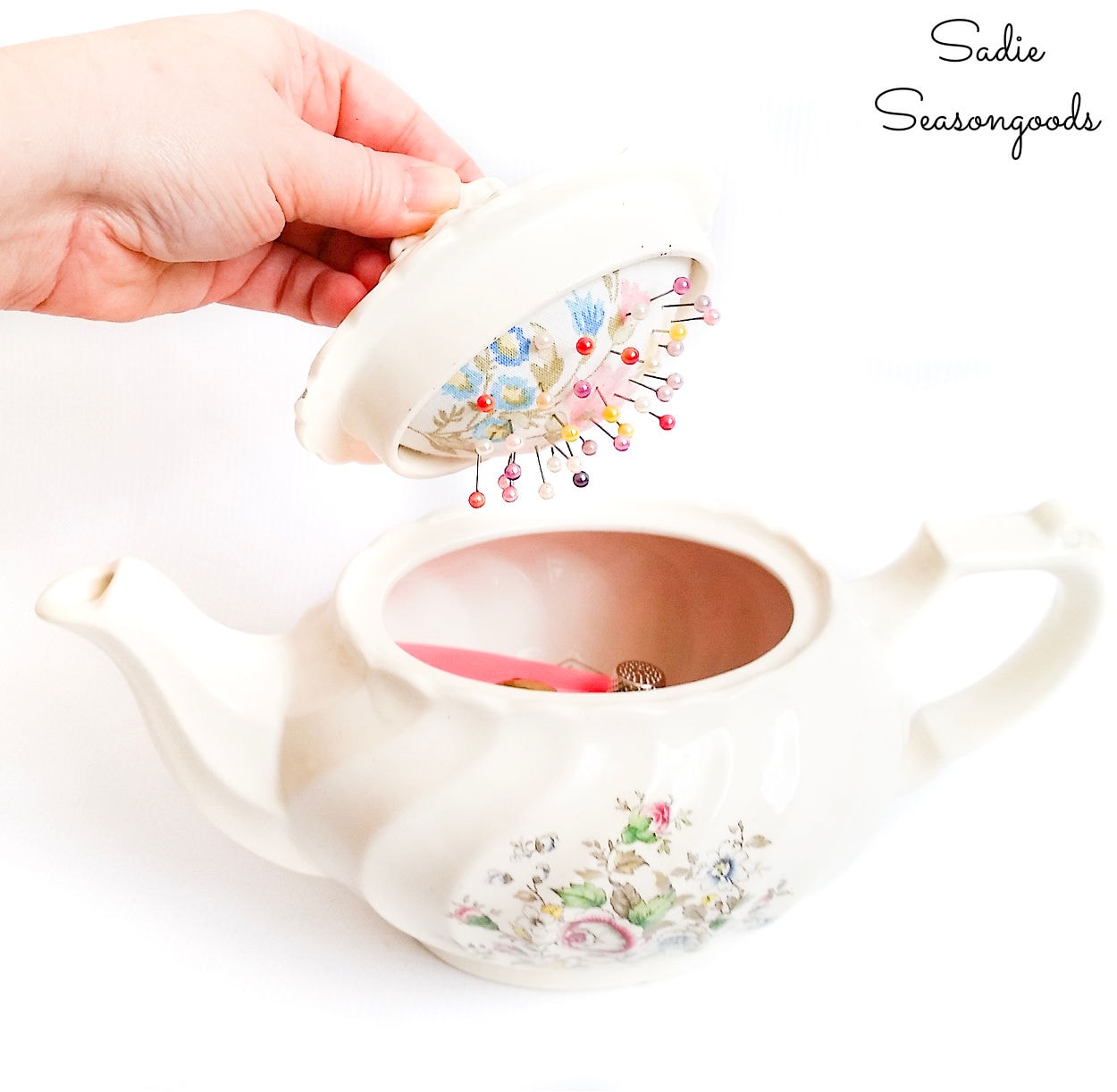 vintage teapot as a sewing caddy