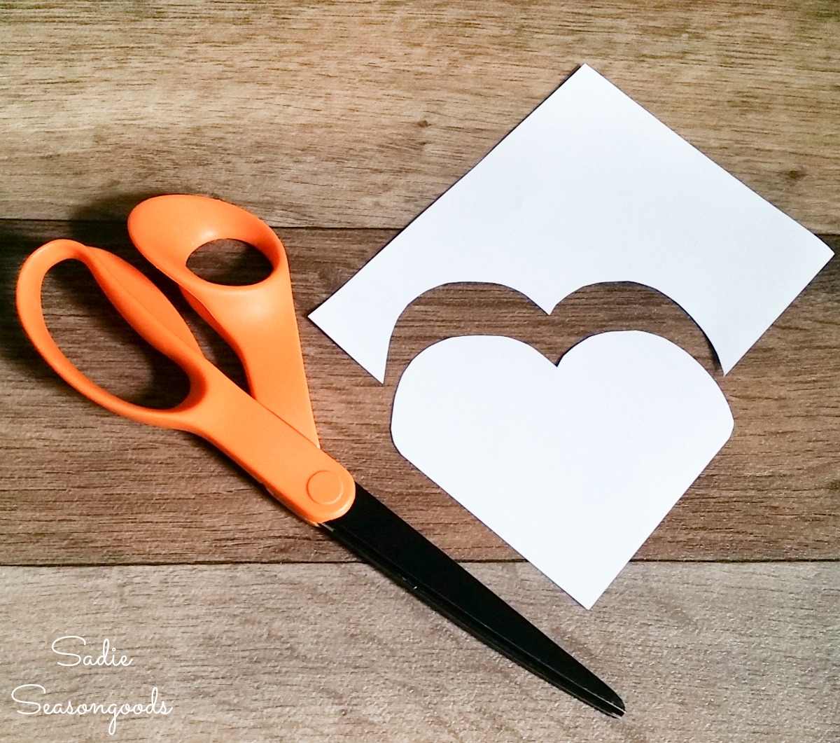 Cutting out a paper template for DIY corner bookmarks