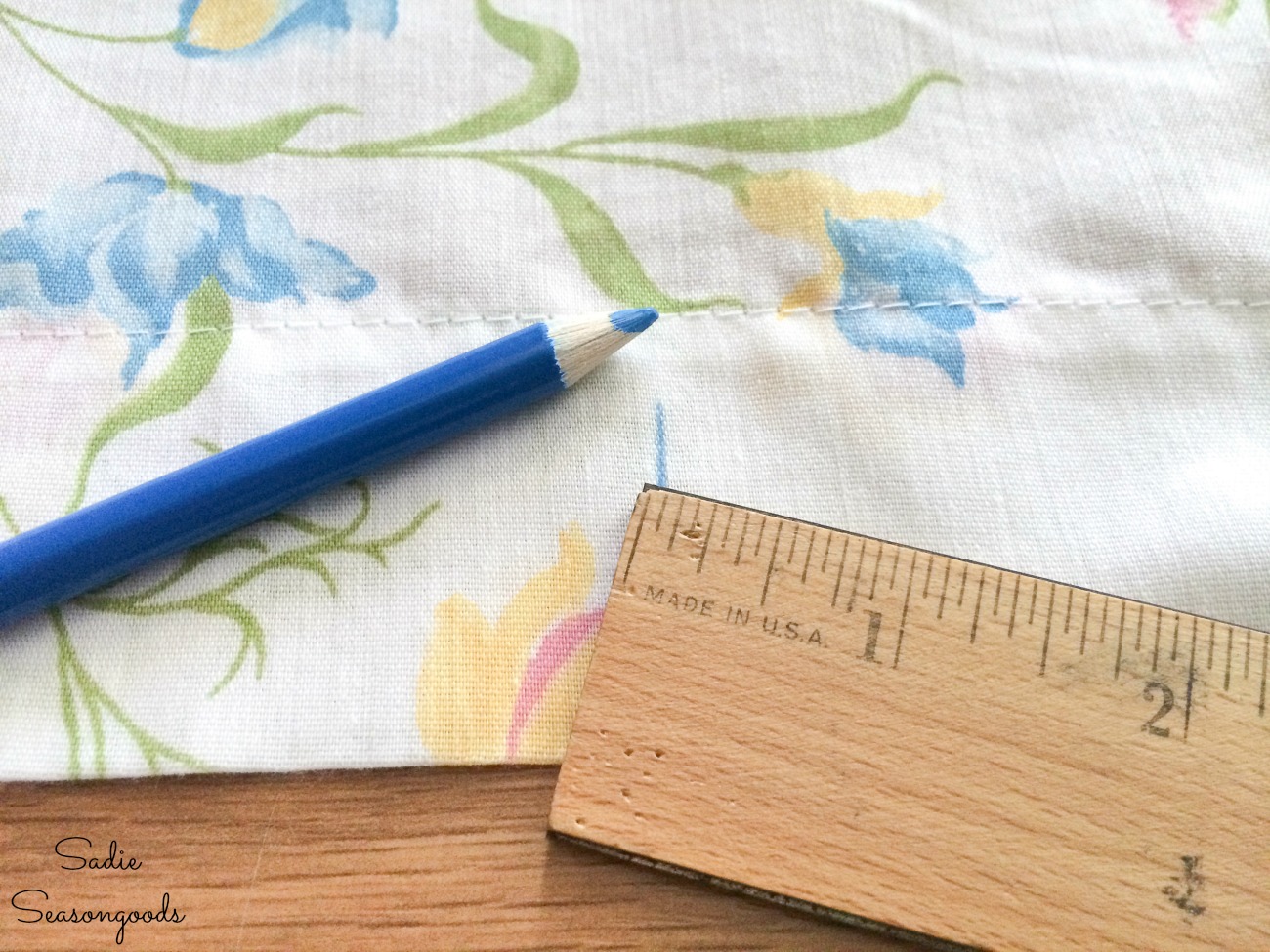 Measuring the placement of buttonholes on a DIY shower curtain