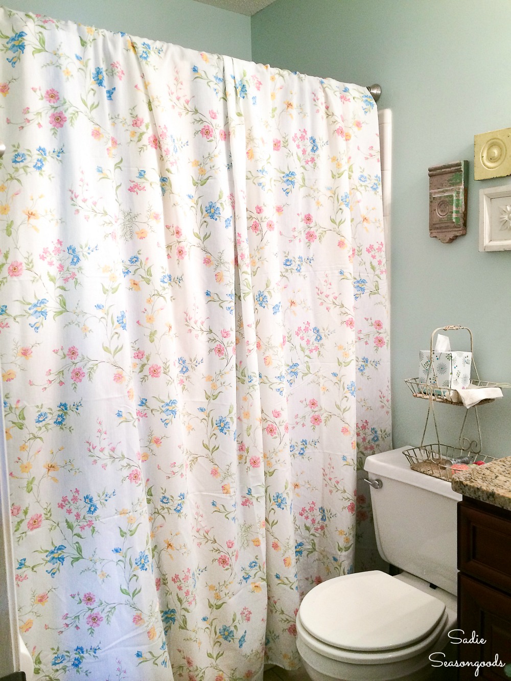 Vintage bed sheets for upcycling as a floral shower curtain