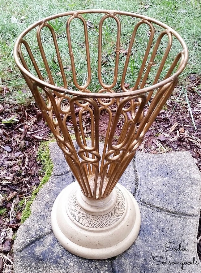 Preparing a garden urn to become a cast iron umbrella stand