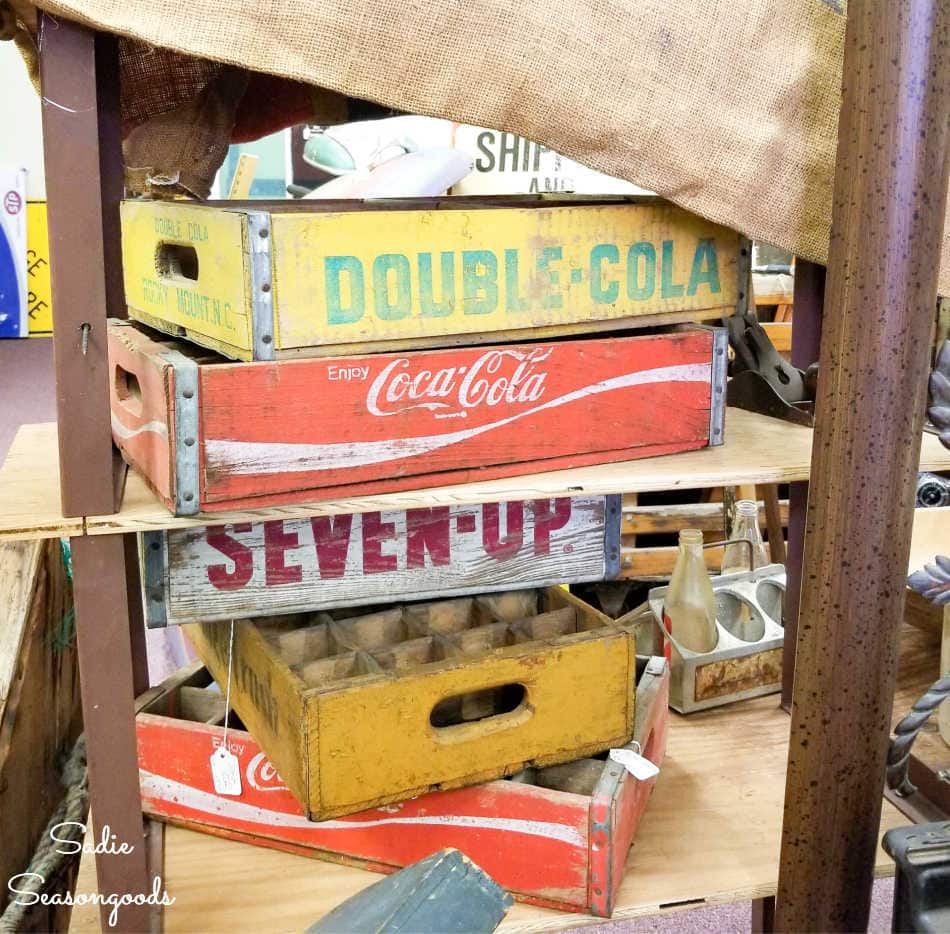 stack of vintage soda crates at an antique store