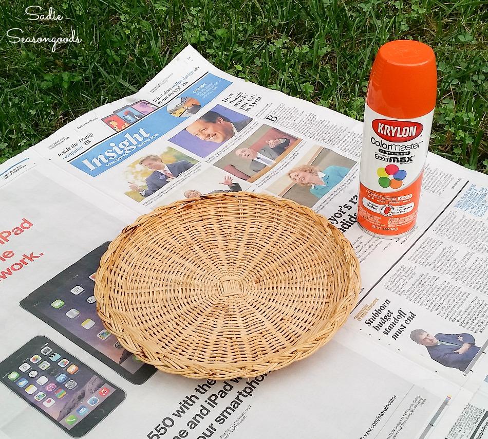 Spray painting a wicker plate holder to look like a pumpkin