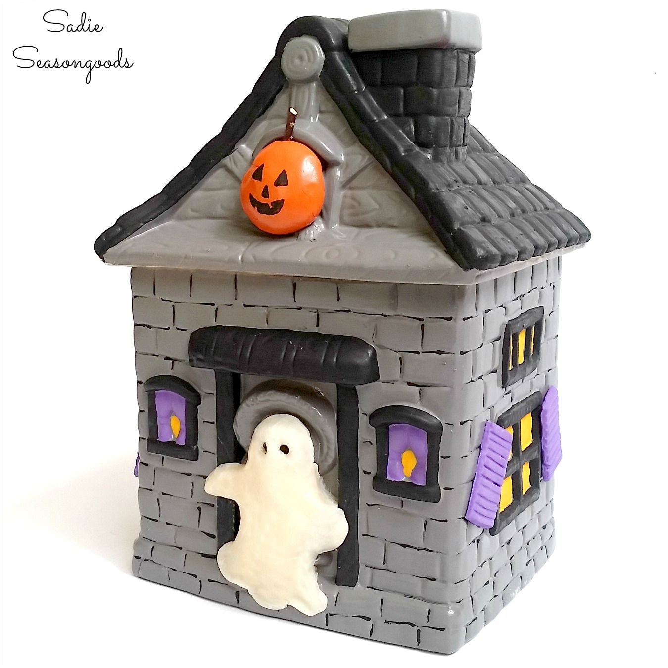 Halloween cookie jar and haunted house decor from giving a Halloween makeover to a vintage cookie jar