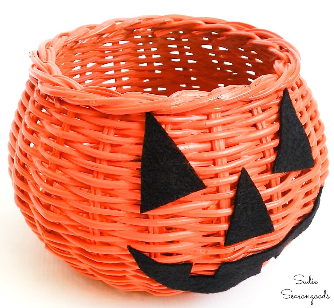 Painting a basket to look like a jack o lantern