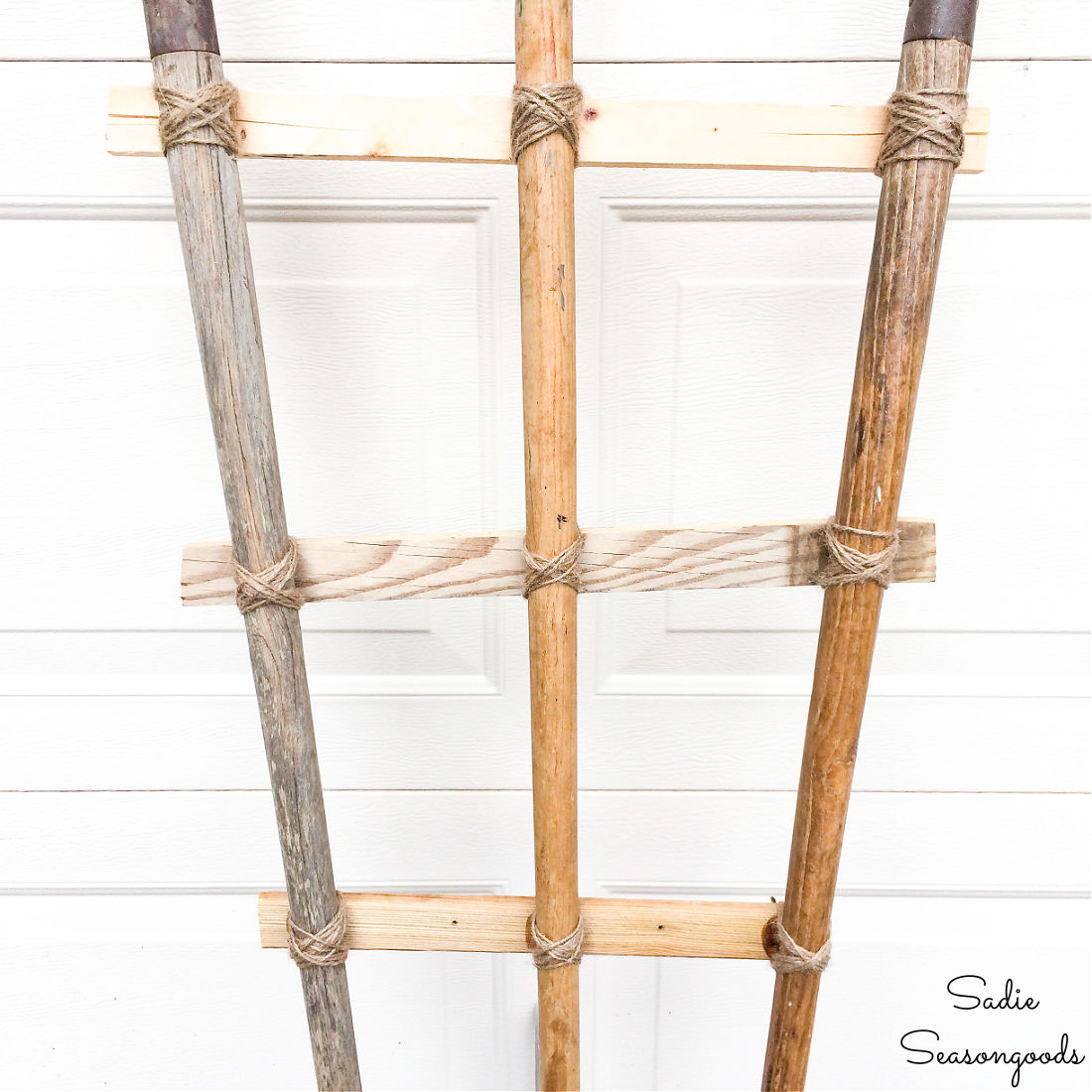 DIY garden trellis with antique garden tools