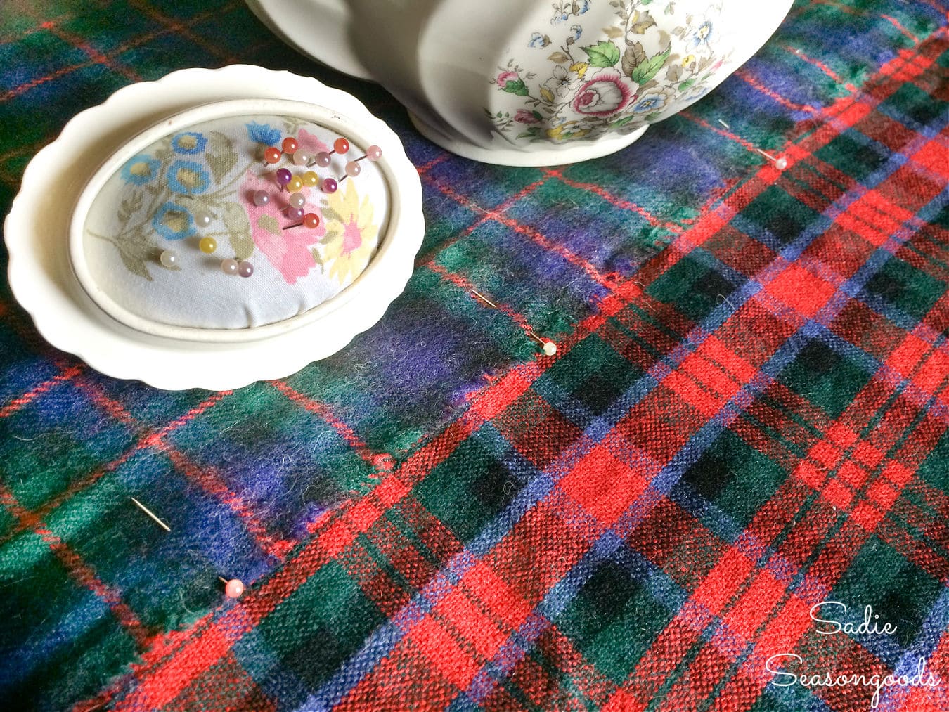 Pinning the tartan scarves together