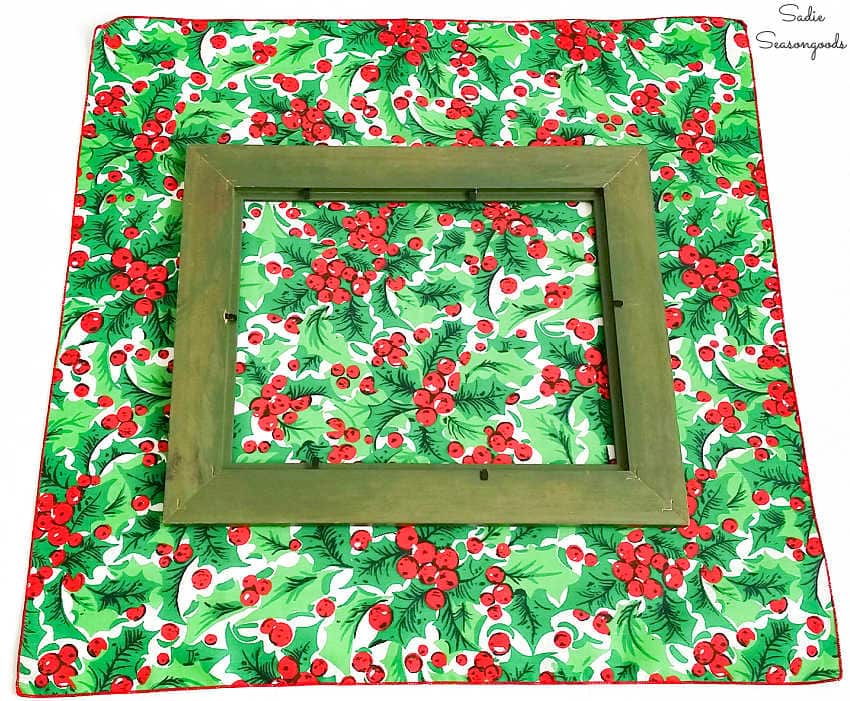 upcycling a picture frame with a christmas napkin