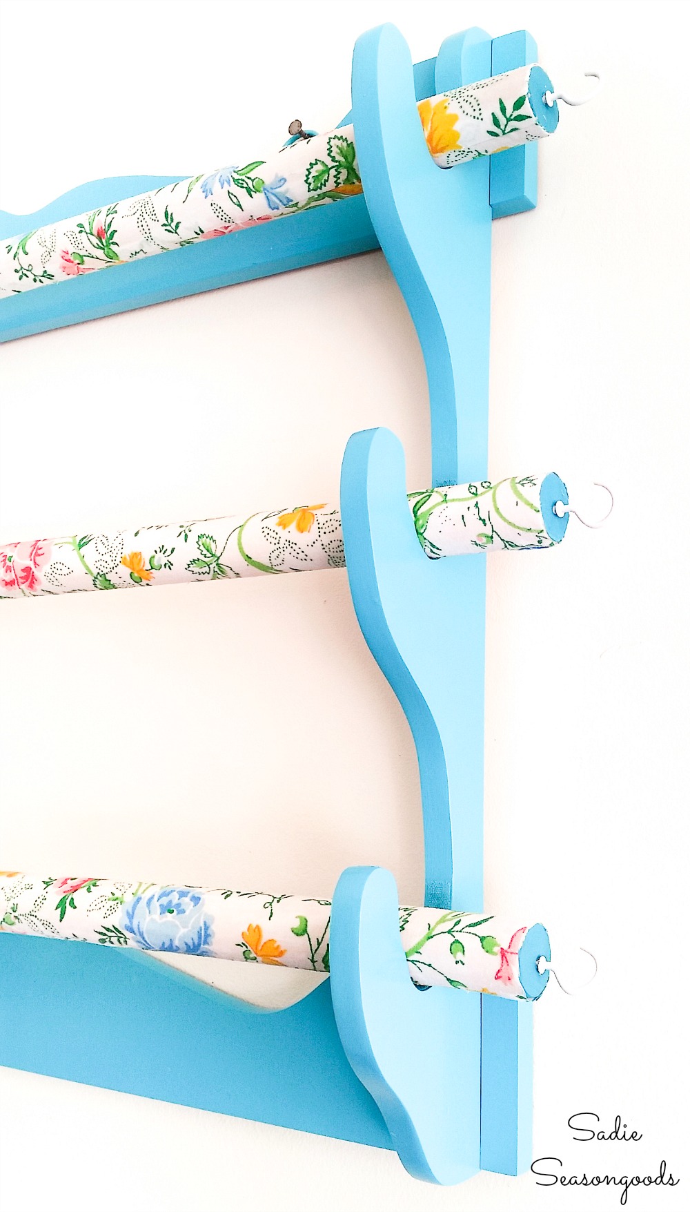 Cup hooks on the ends of a fabric organizer for fabric scraps