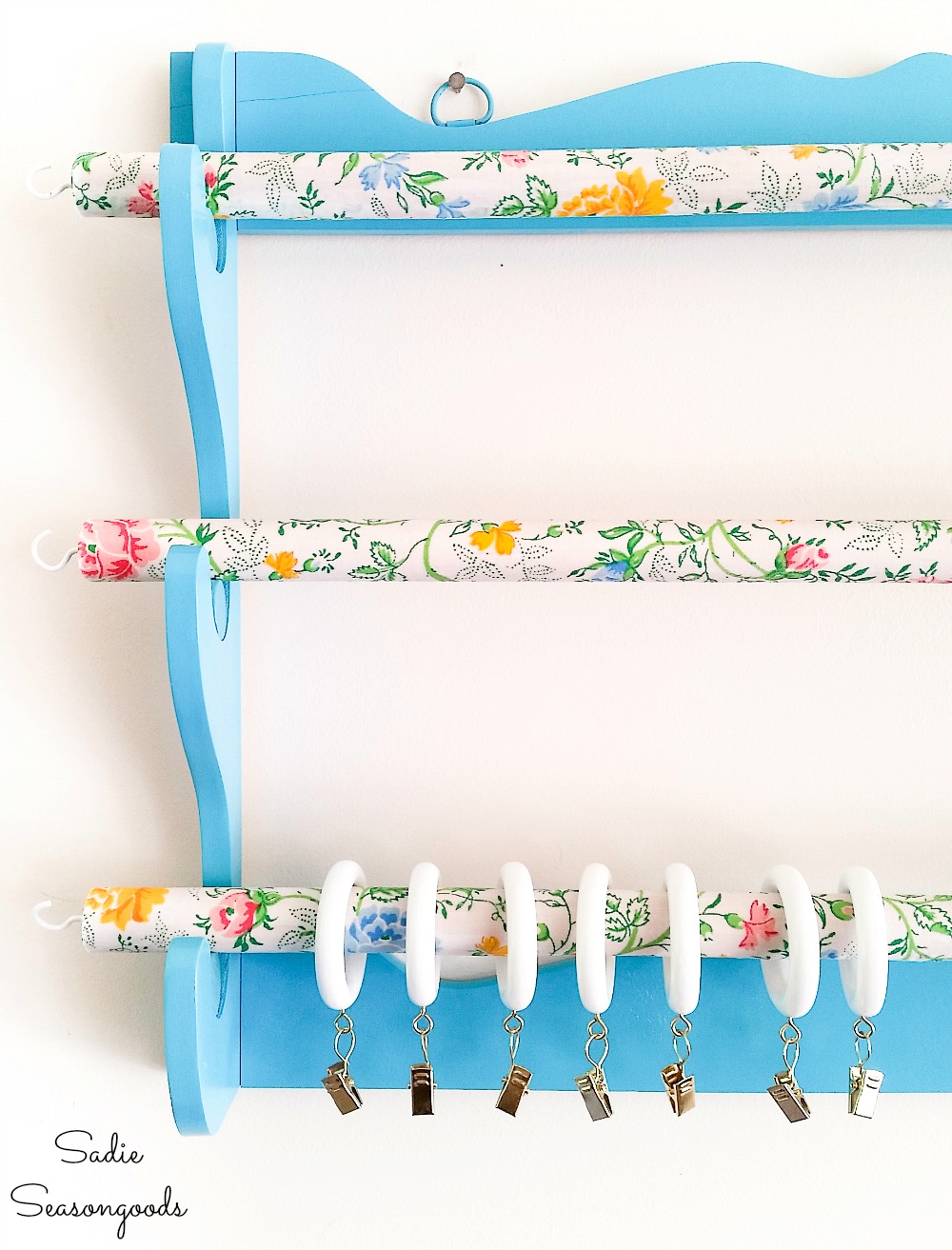 Hanging gun rack as a fabric organizer for sewing room storage ideas