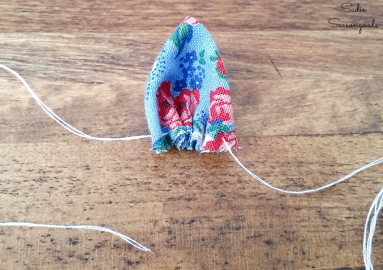 Sewing a floral brooch with vintage fabric