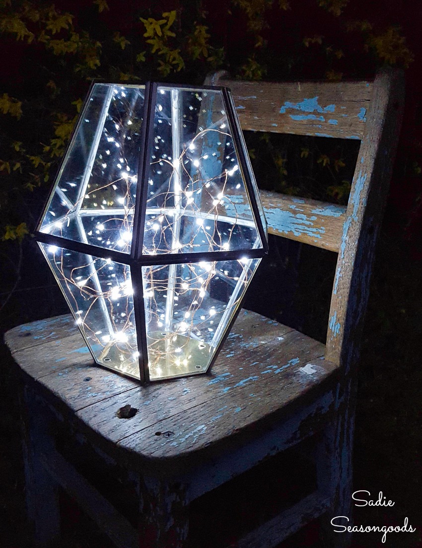 Firefly lights in upcycled lighting as a porch lantern