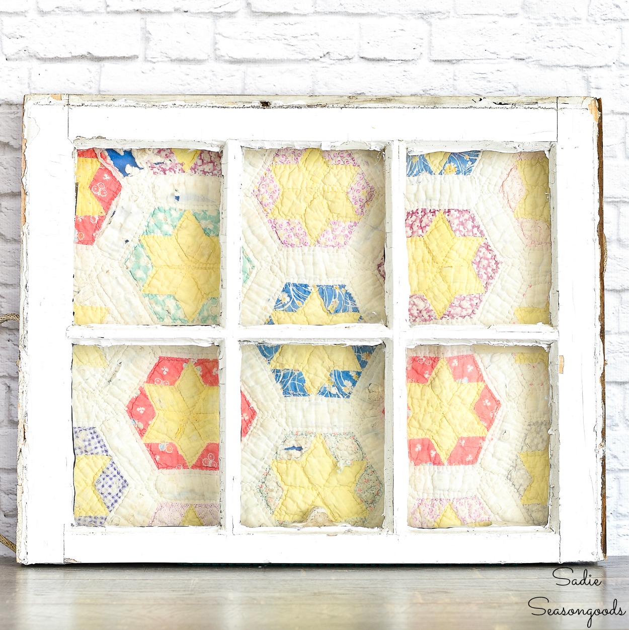 How to display a vintage quilt in an antique window as a quilt frame