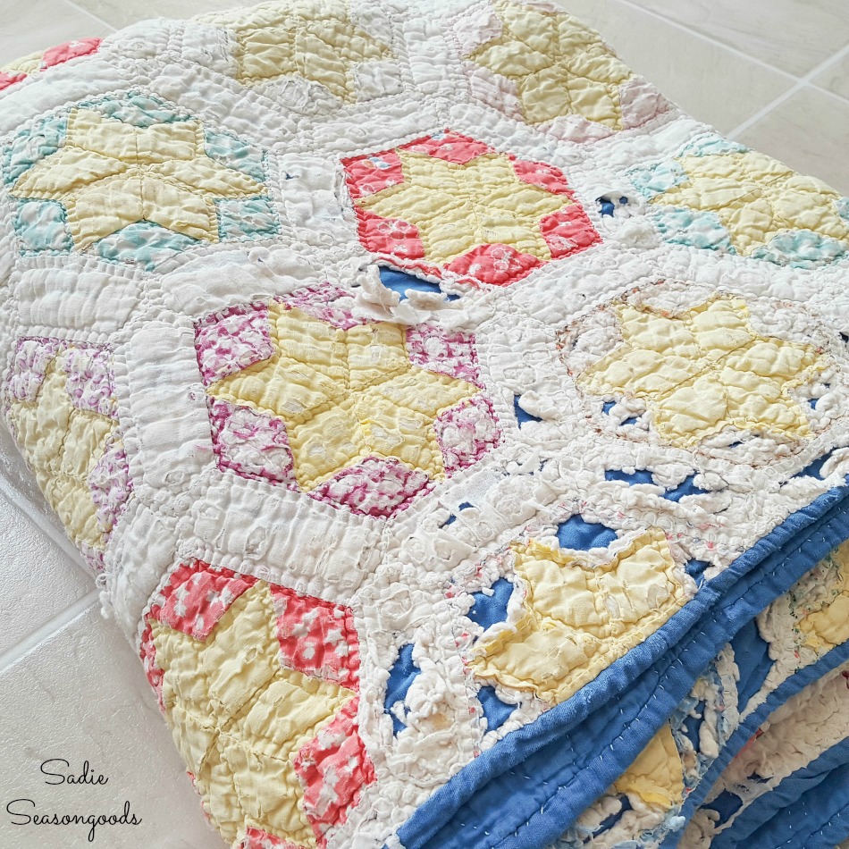 Vintage quilt that is falling apart for upcycling crafts