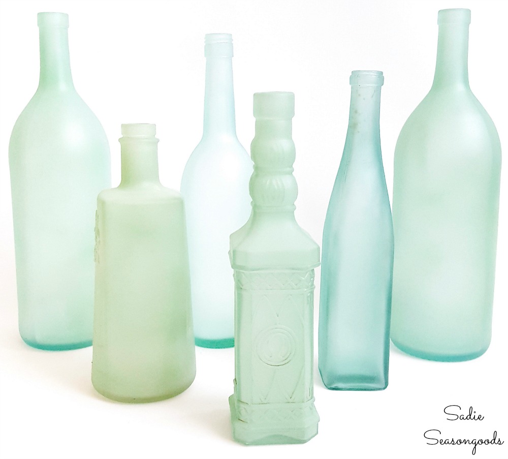 Sea glass bottles as wine bottle crafts for beach theme decor