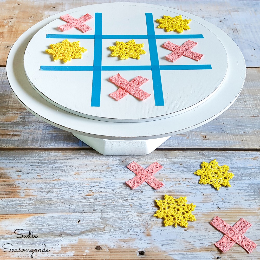 Upcycling a wooden cake stand as a tic tac toe game board