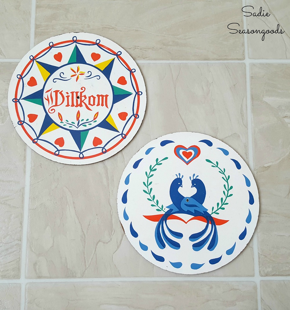 Hex Signs from the thrift store to be upcycled into outdoor wall decor for a tool shed by Sadie Seasongoods