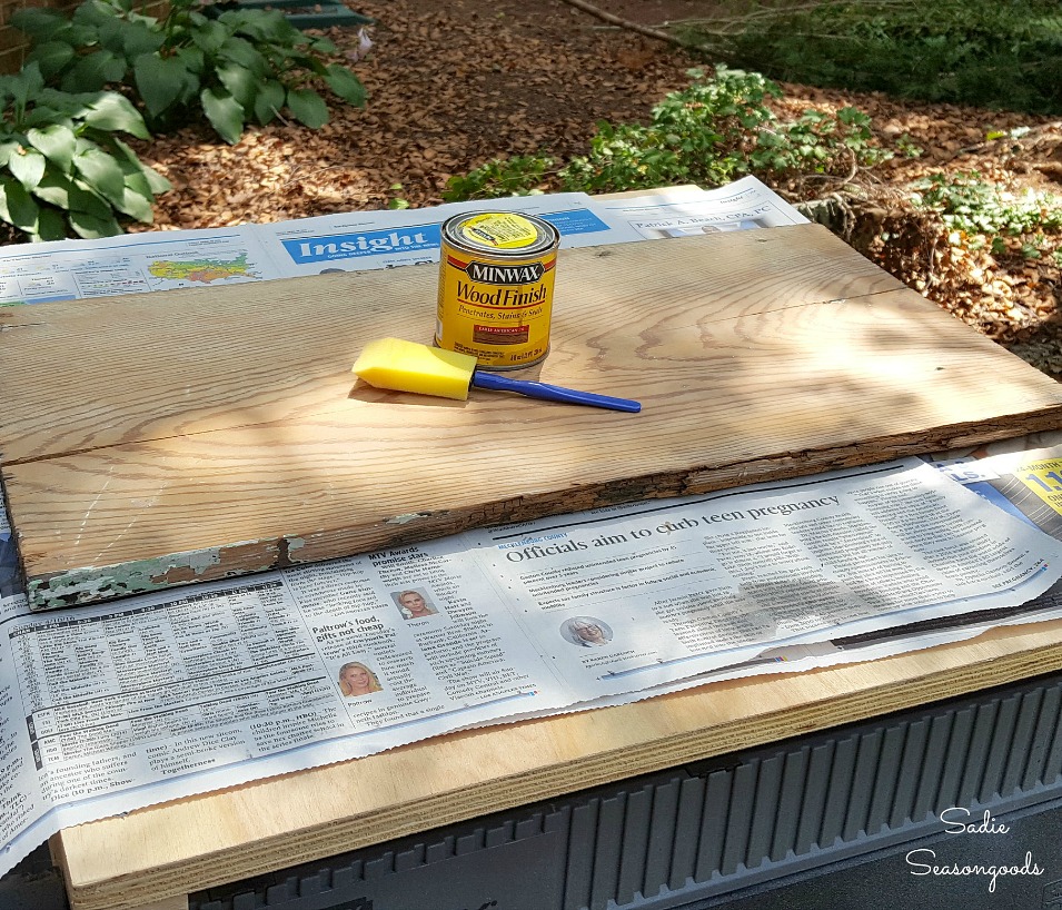 Wood stain on salvaged wood and will be upcycled into outdoor wall decor with hex signs by Sadie Seasongoods