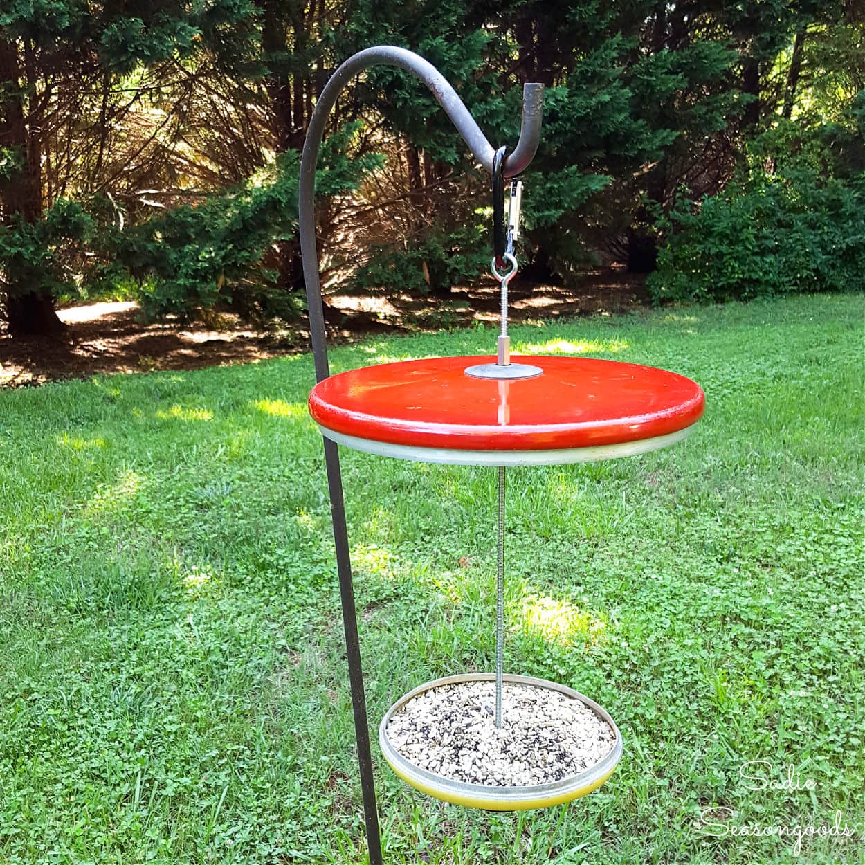 Platform bird feeder from repurposed pot lids