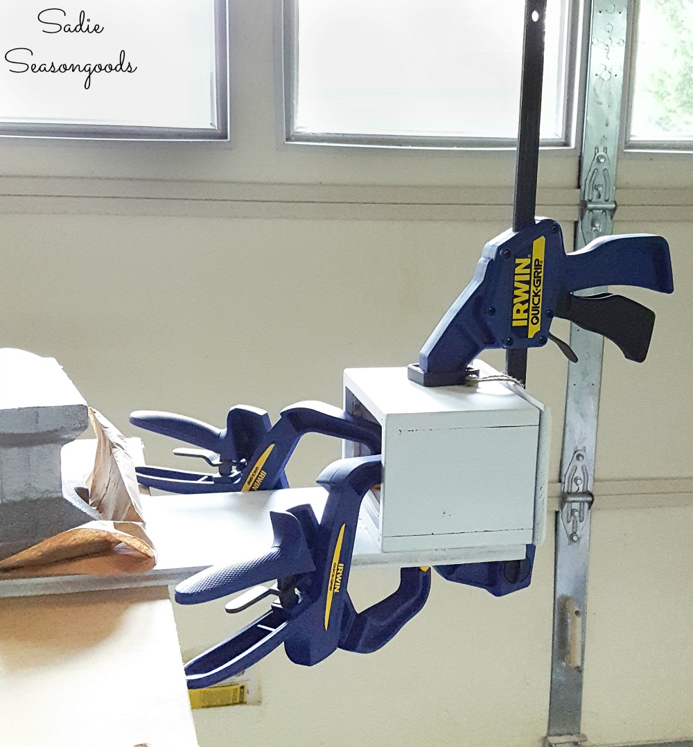 Attaching a cap catcher to a bottle opener for a man cave bar