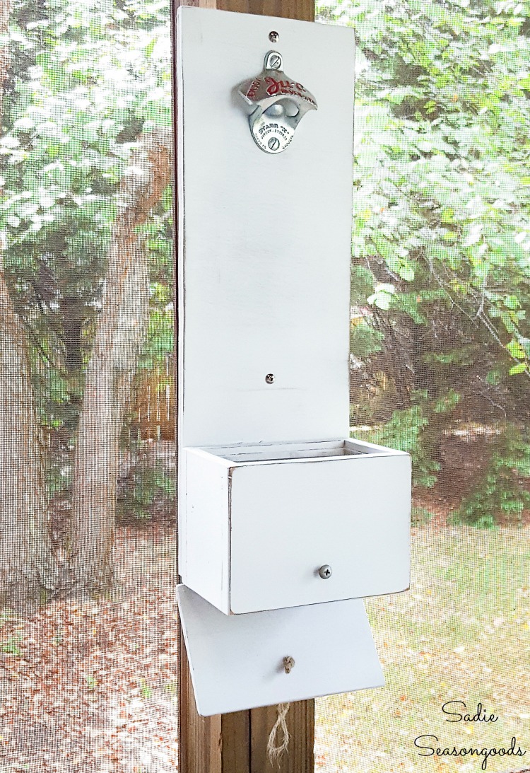 Emptying a cap catcher on a wall bottle opener