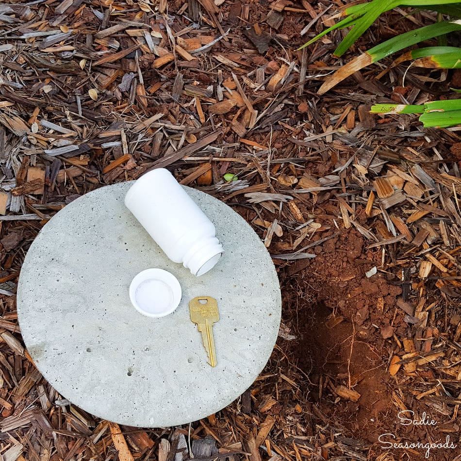 Cake pan stepping stone with key hider