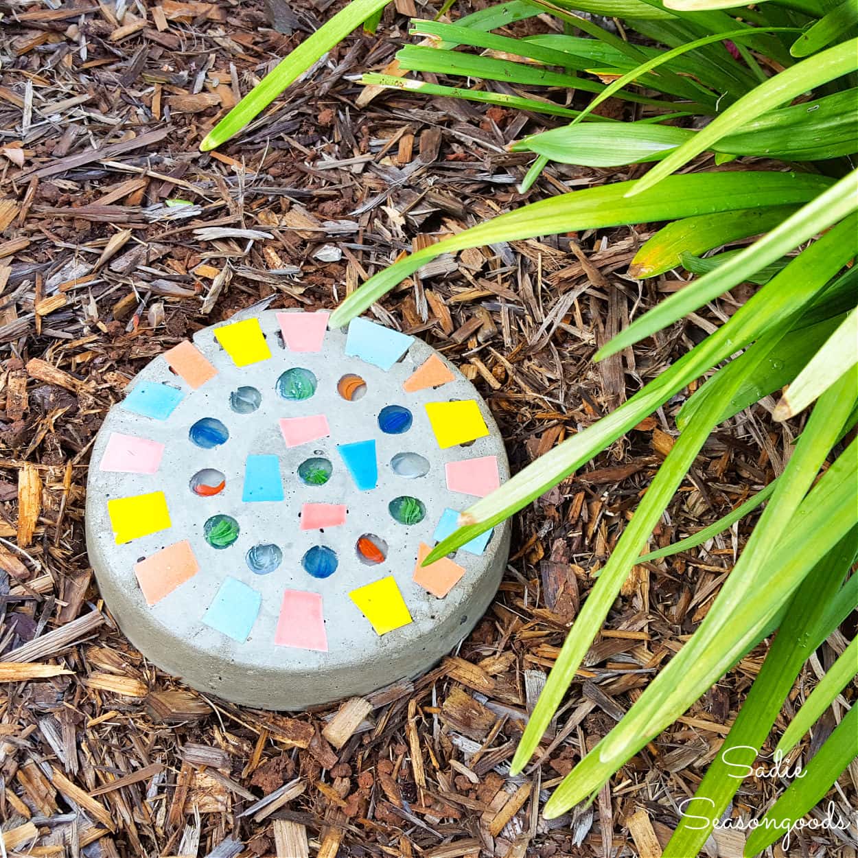 DIY mosaic stepping stone with key hider